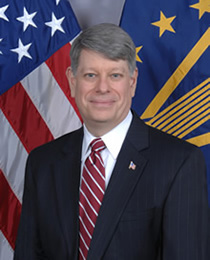 Administrator, Christopher E. Thomas