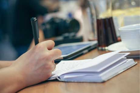 Man writing at desk